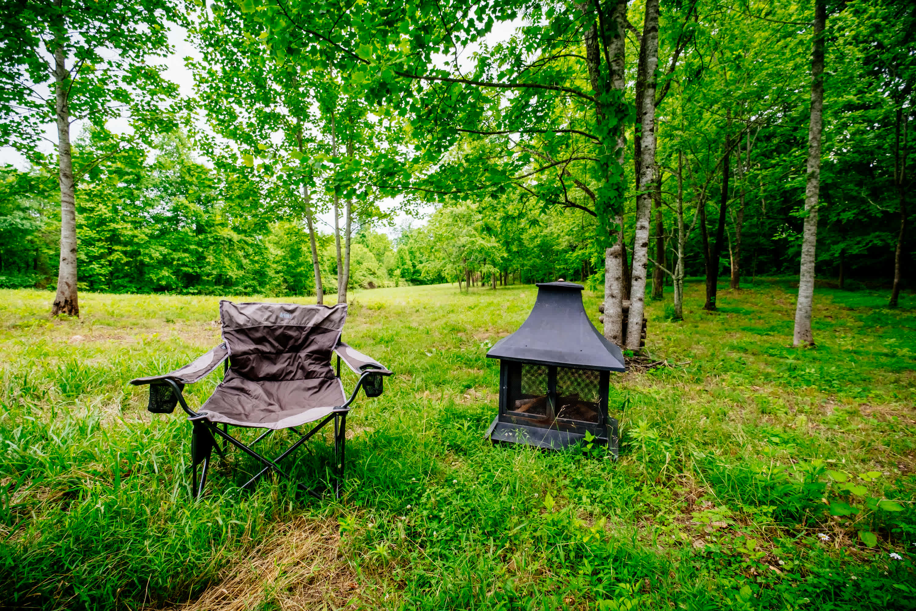 Outdoor fireplace & provided camp chairs 