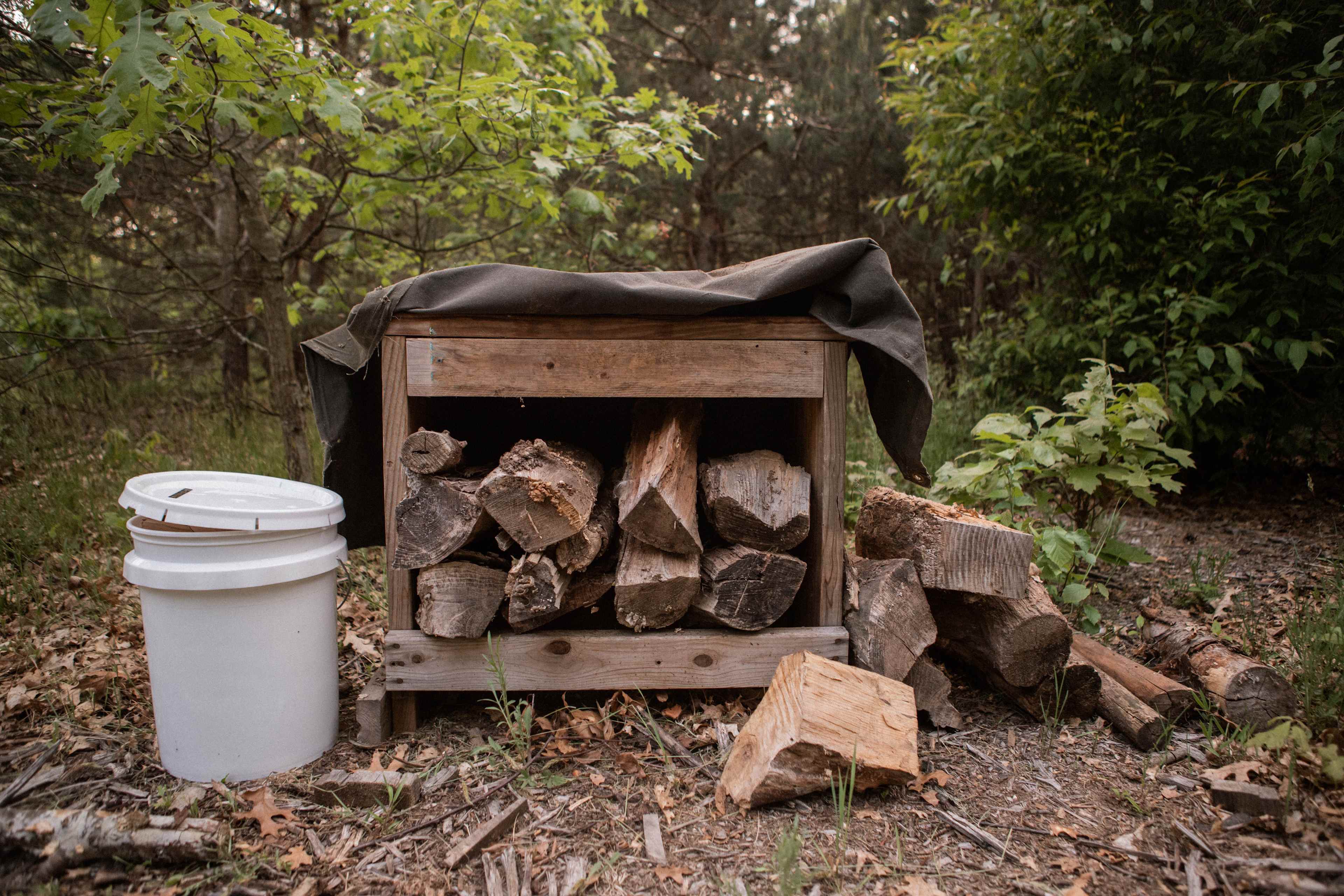 The firewood is kept safe and dry in this covered structure!