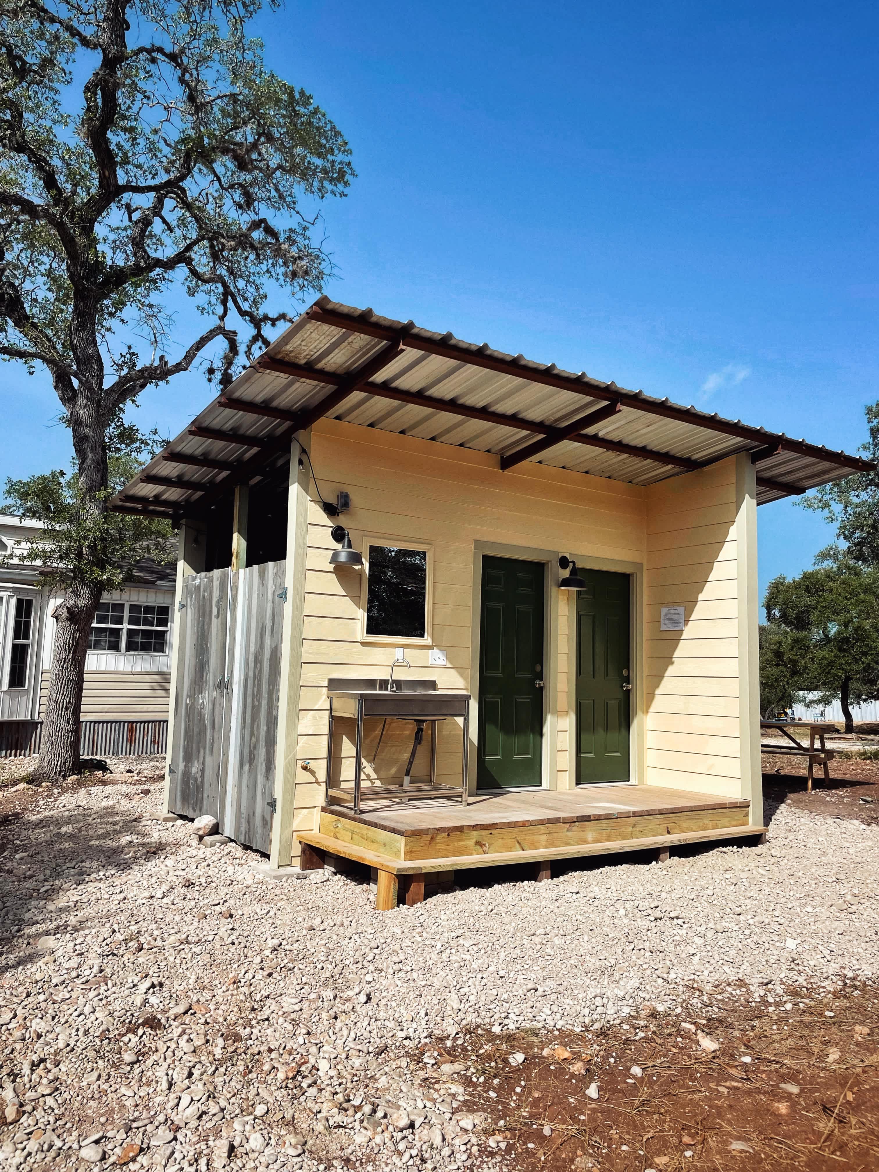 NEW Bathroom for Campers and RVers! 
2 stall showers, 2 stall toilets, sink, charging area and electric grill