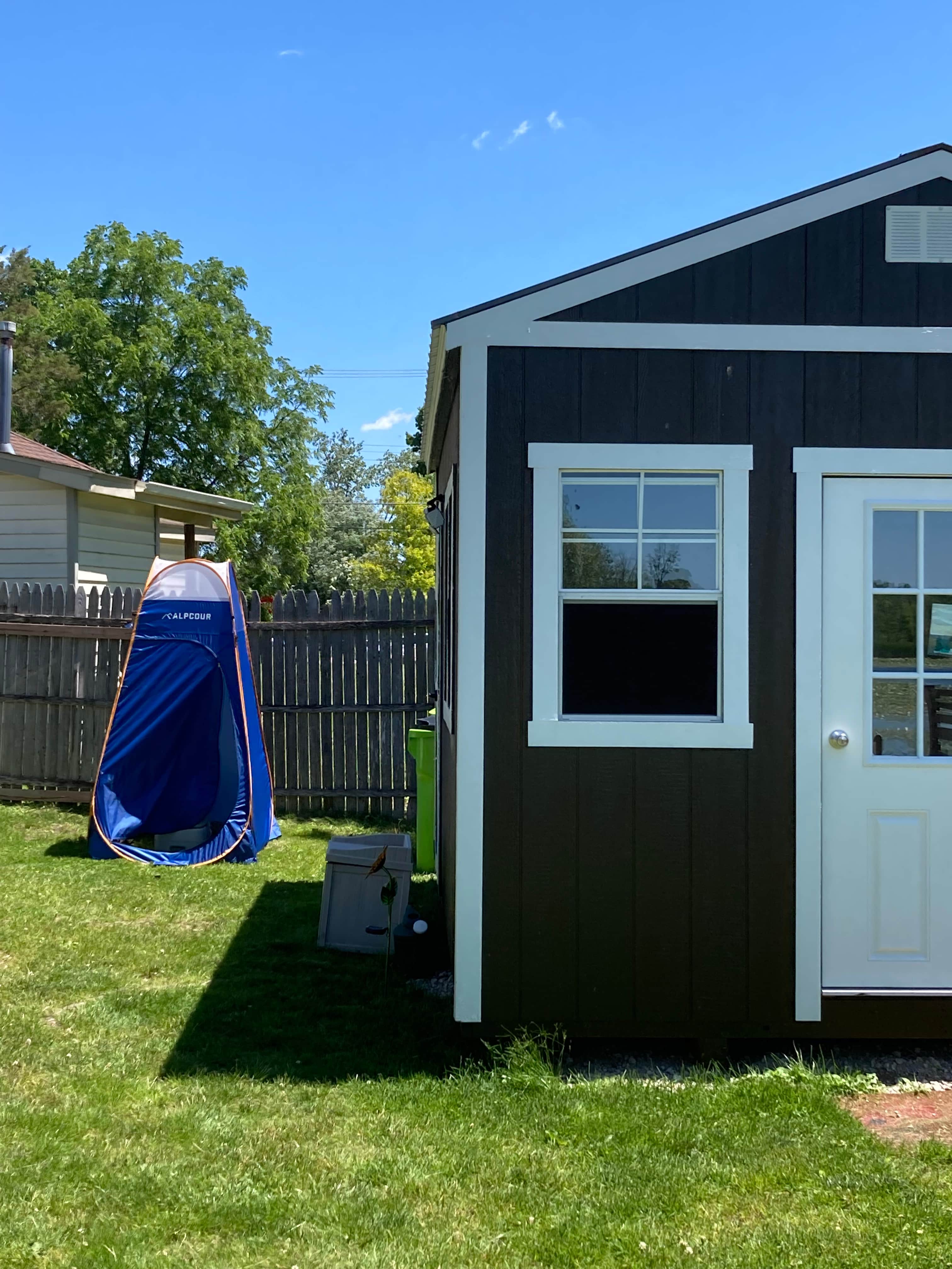 Pop-up with portable and flushing camping toilet.