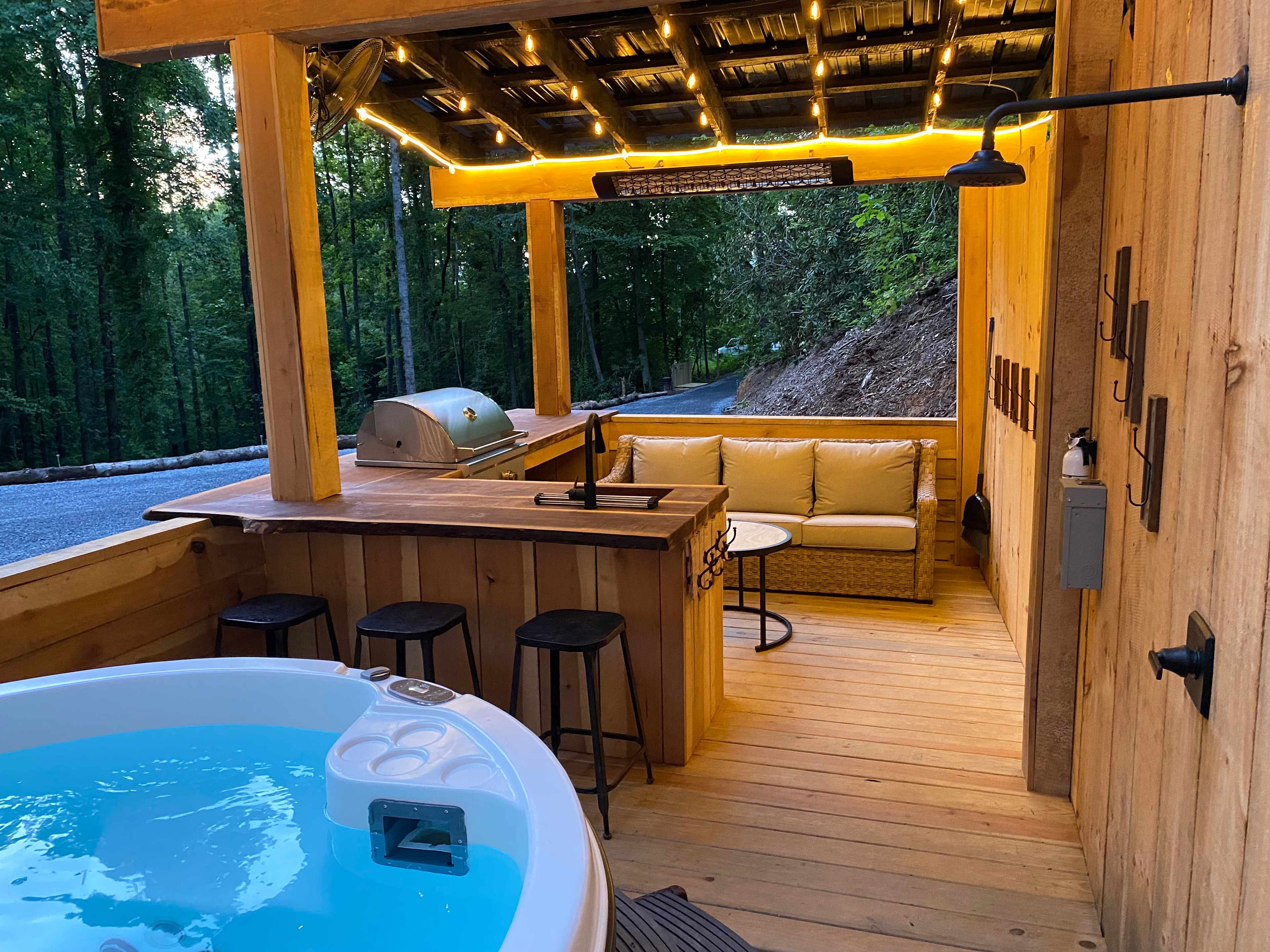 Outdoor kitchen and hot tub/shower area available to rent in the extras section