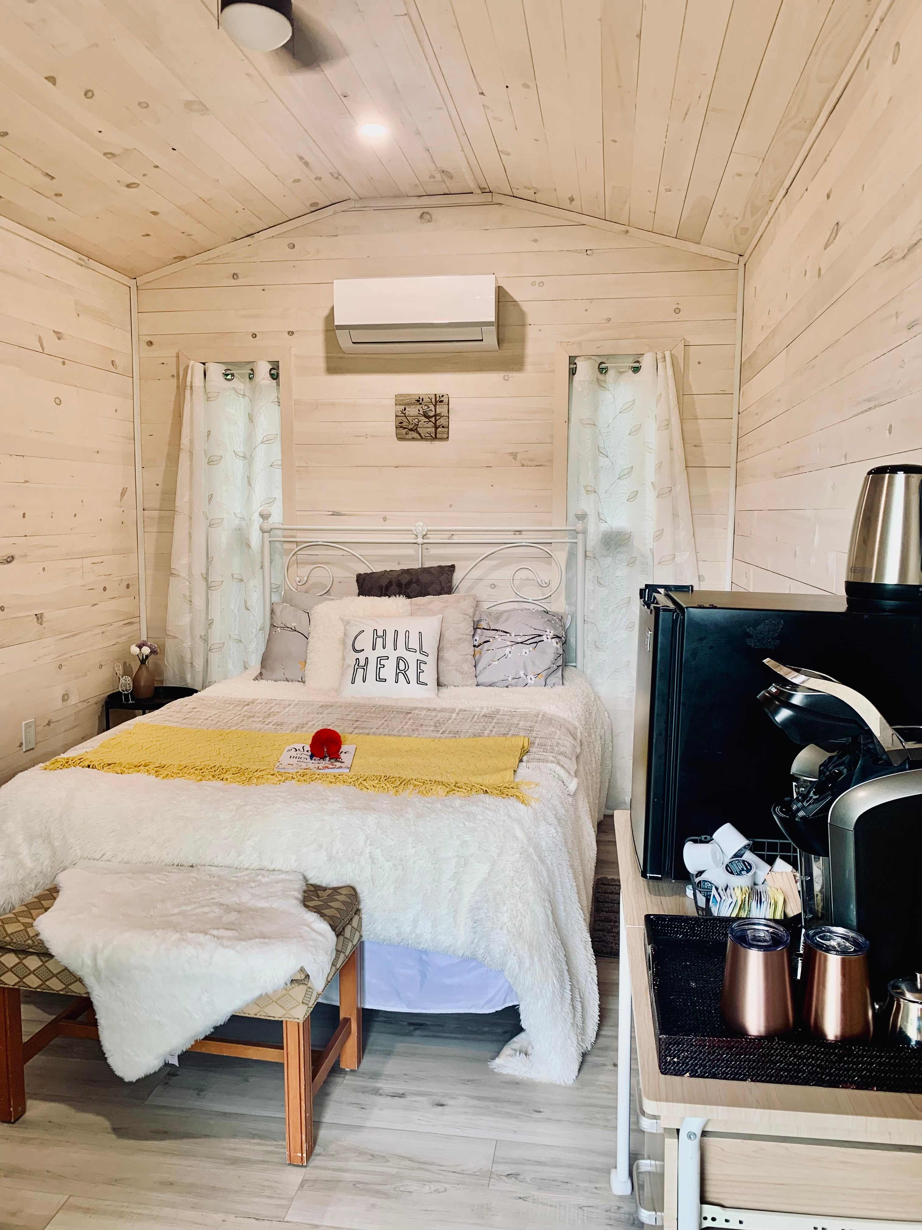 Each cabin comes complete with a queen bed, AC/Heatpump to keep you comfortable year round, a mini fridge and a coffee bar. 