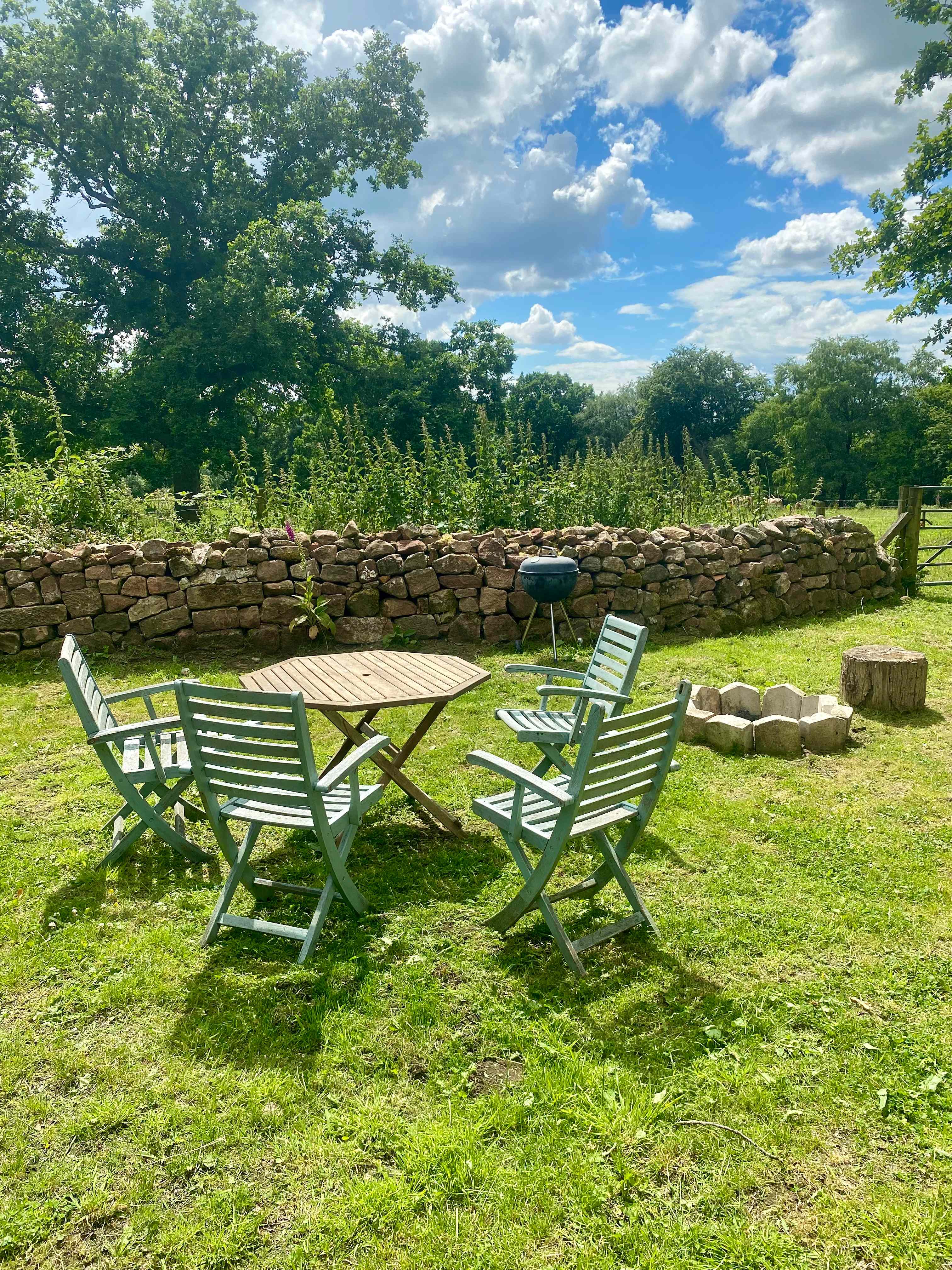 Our outdoor seating area complete with fire pit for toasting marshmallows by and the barbecue for those alfresco meals.