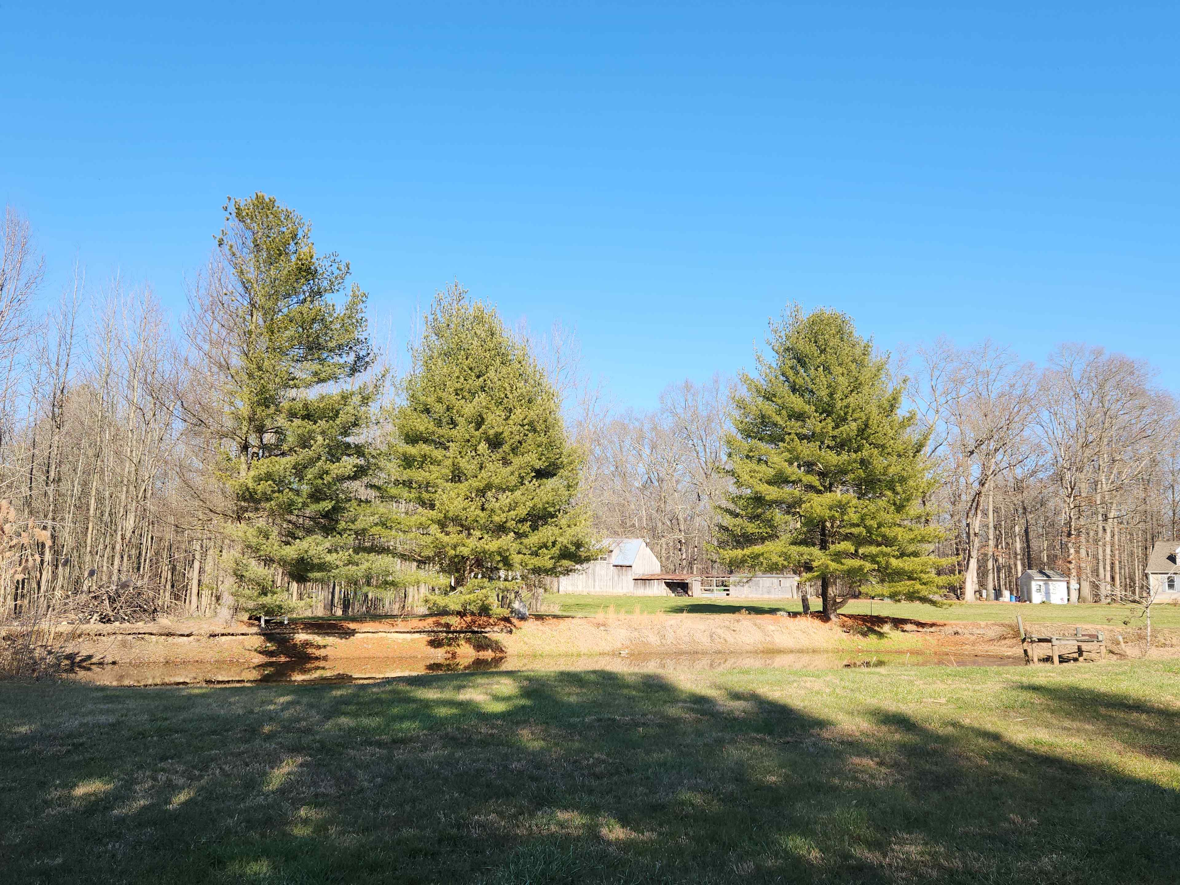 This shows you the first look of the property you see that shows the pond and barn in the back ground. 