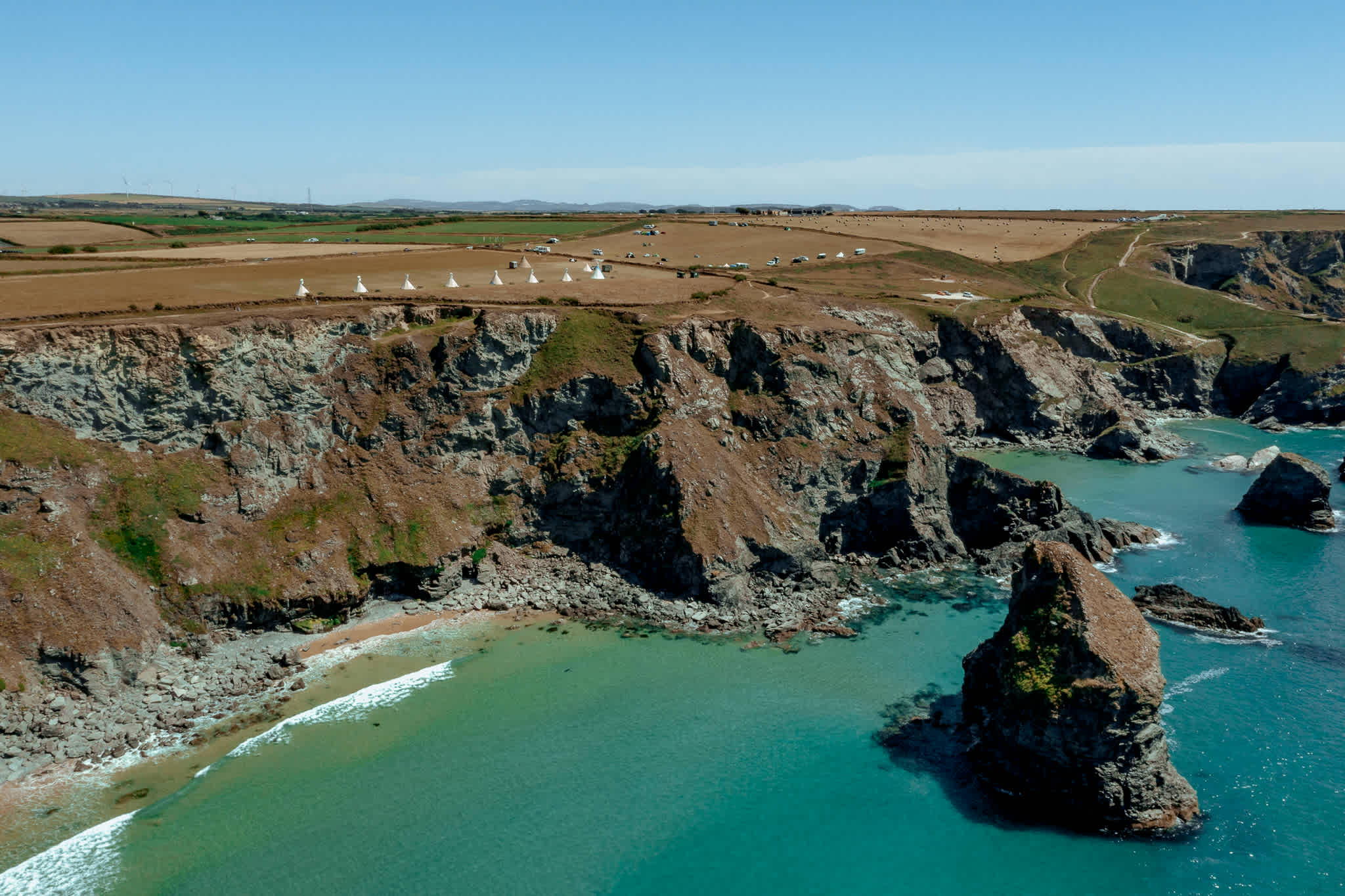 Bedruthan Steps below the tipis.
