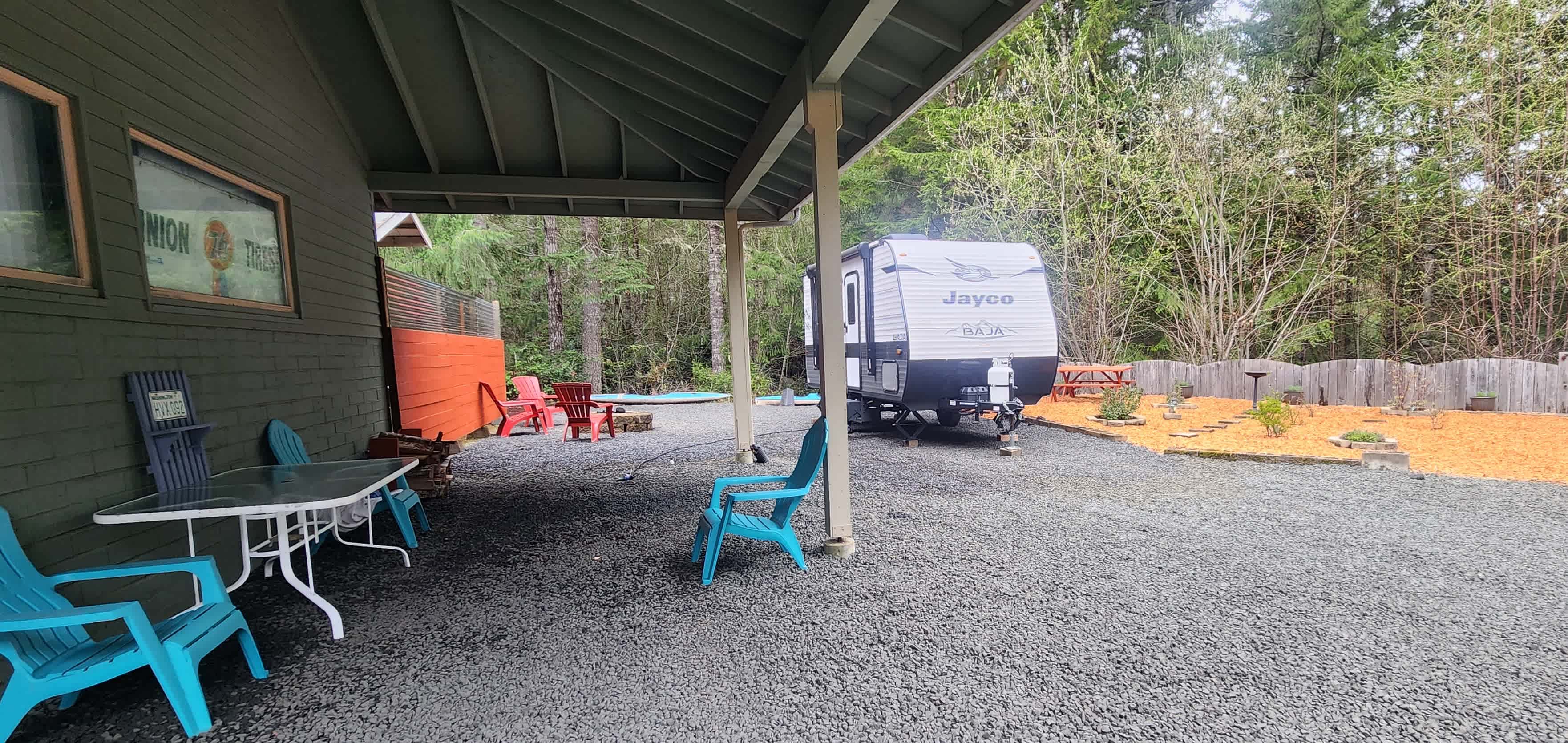 Utilize the covered area to get out of the elements or set up an additional tent 