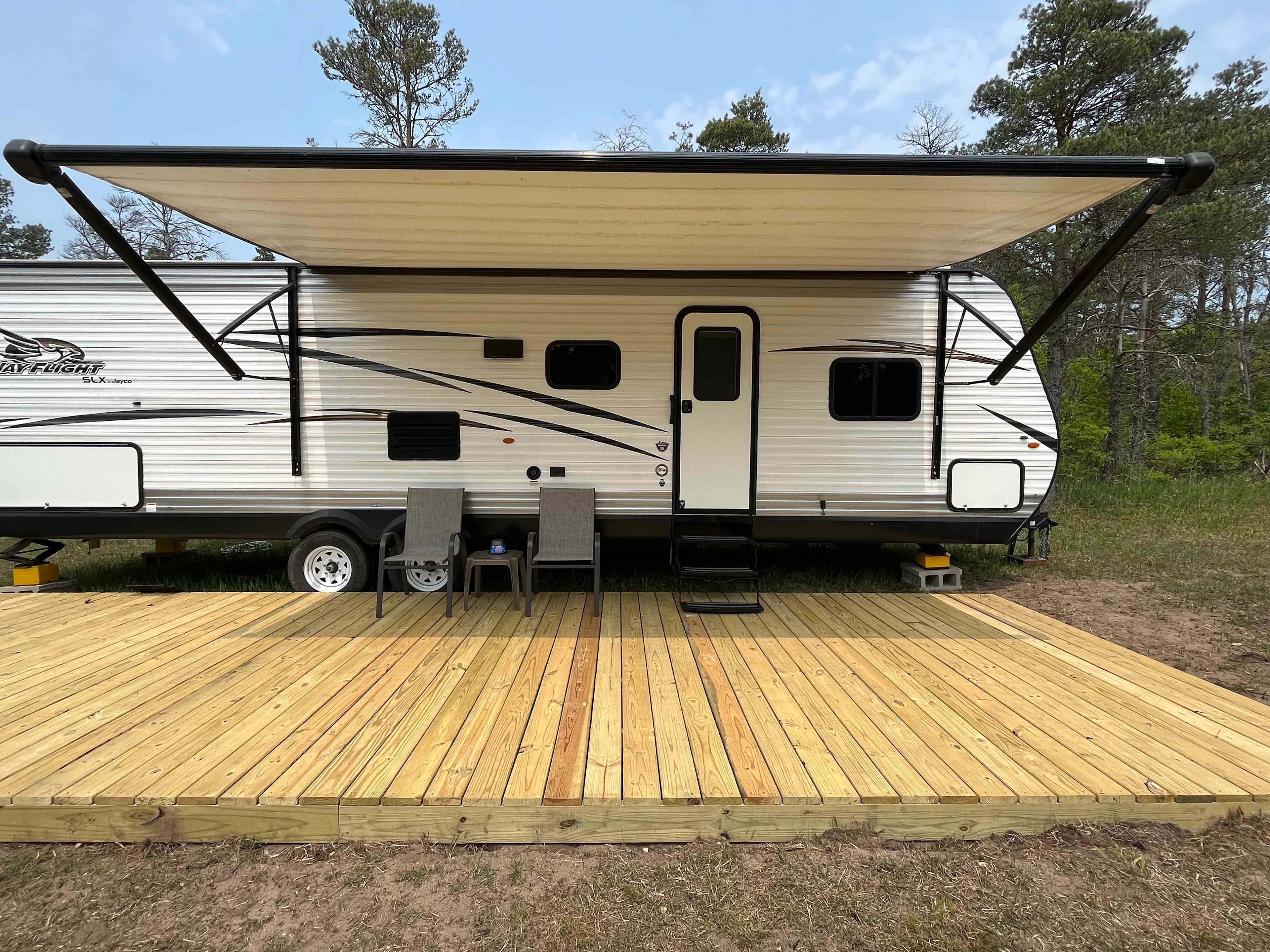 Private campsite with camper