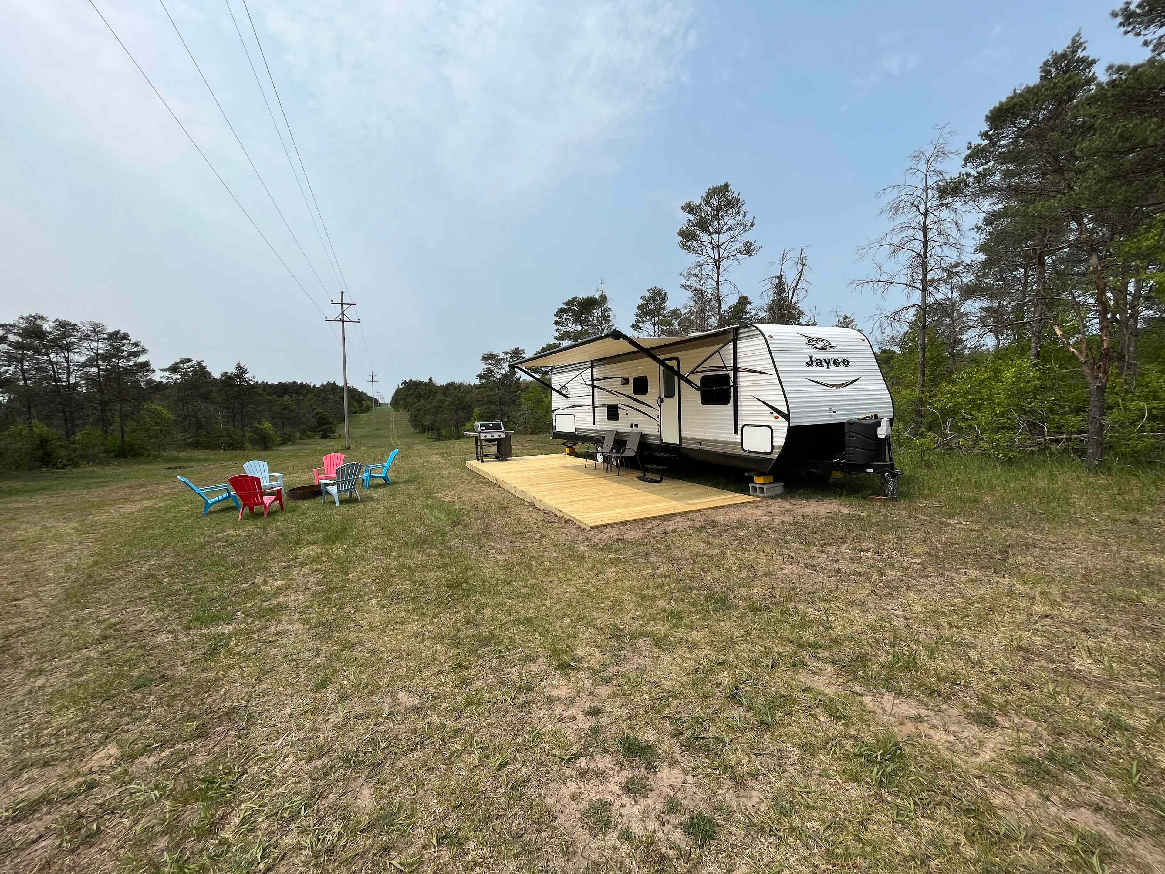 Private campsite with camper
