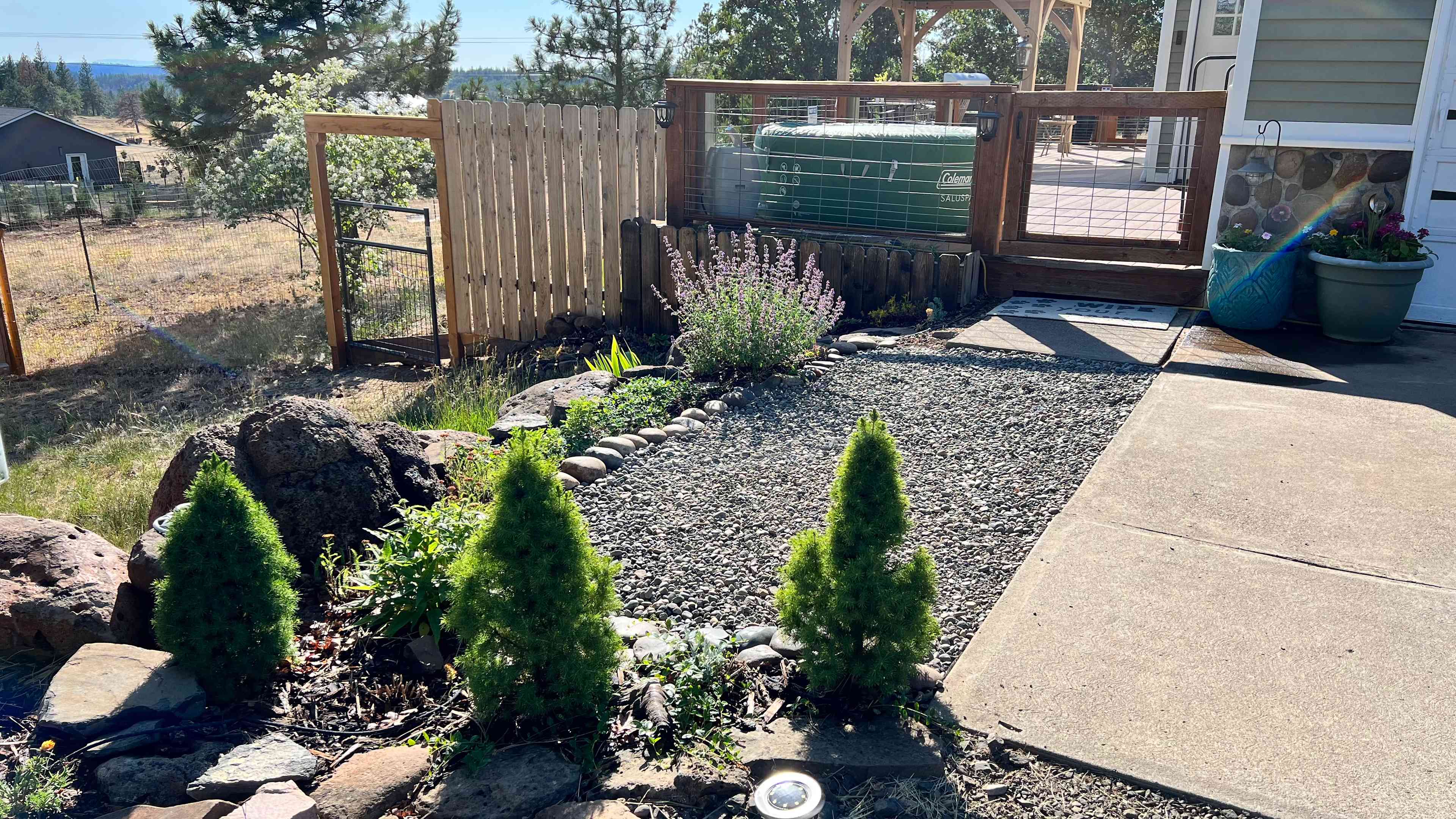Front approach of the house; this is where you access the front pavilion, fire table, BBQ, and goats. :)

The house is also a bed and breakfast available on Airbnb (Woodland Escape). 