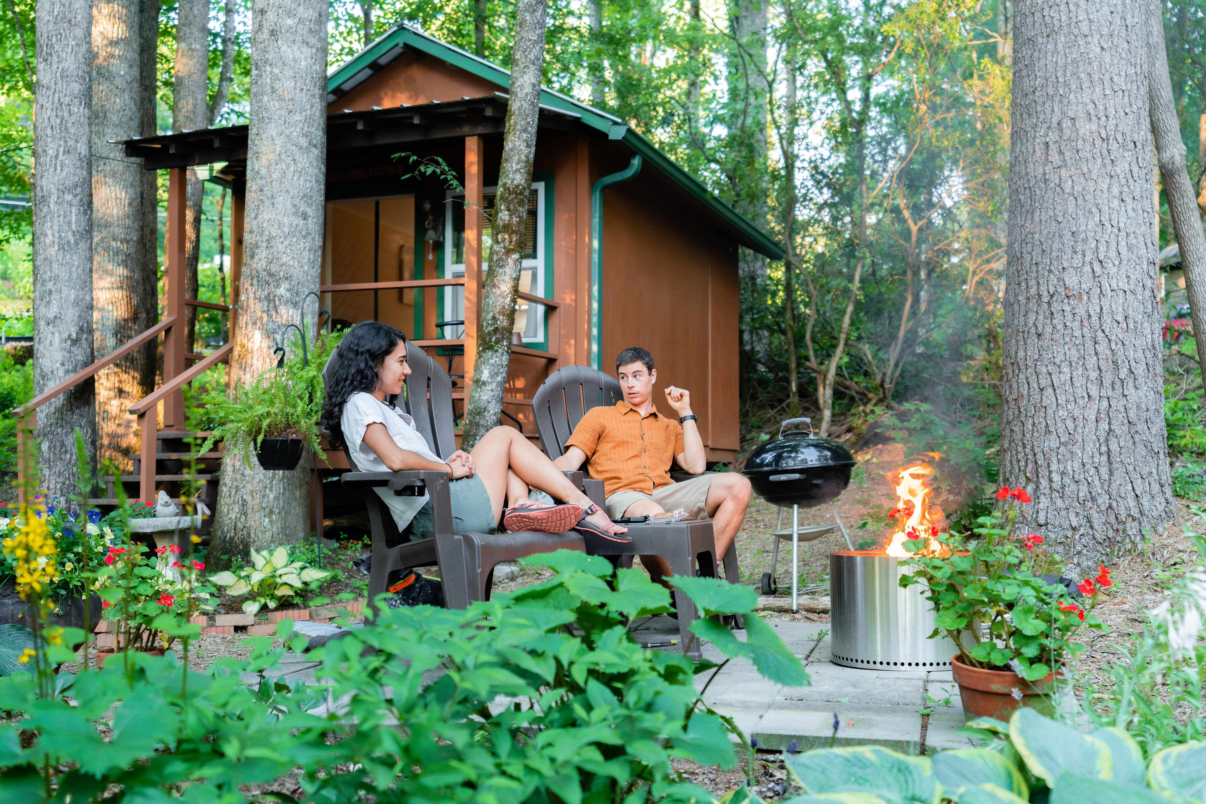 Sitting by the fire outside of The Nest cabin. 