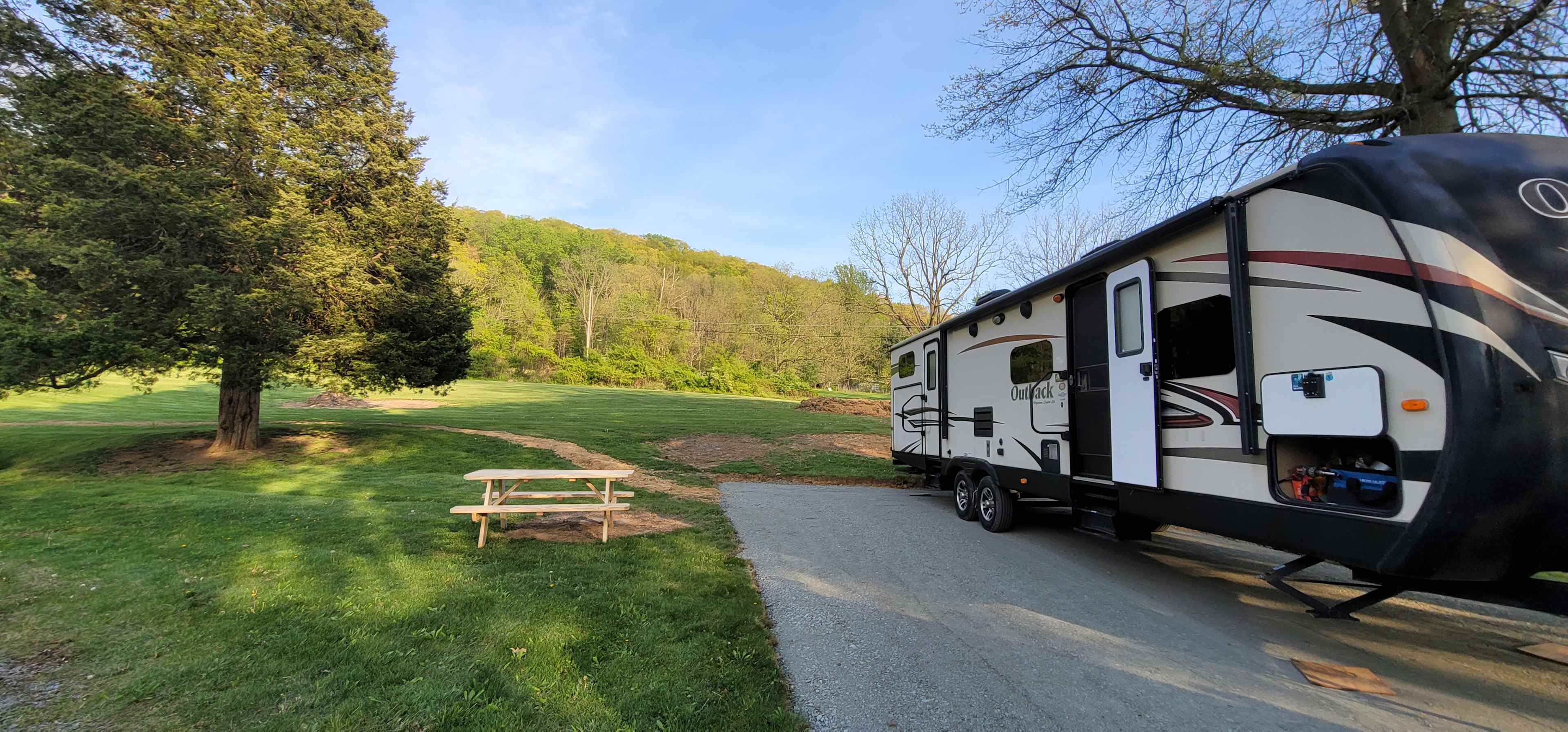 Outside Area, Fire pit ring is to the left of the picnic table. 