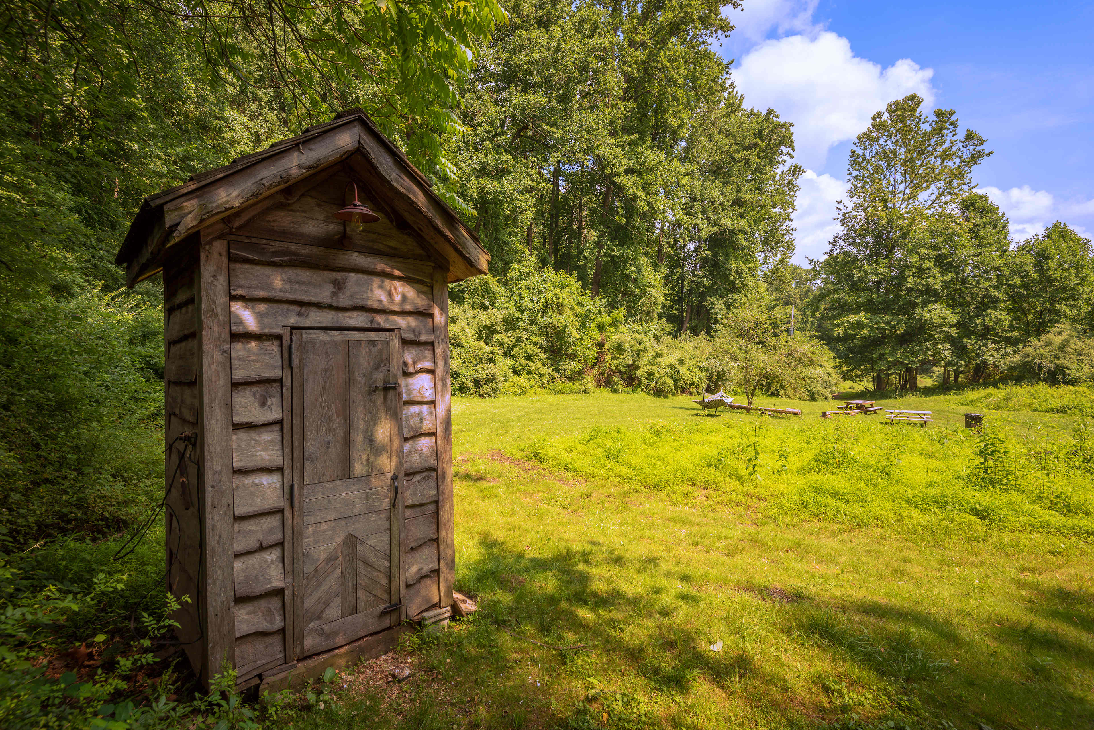 Site #2 is a huge site with a ton of space available for a large group. It has a private outhouse, hammock, firepit, and entrance into the woods for hiking.