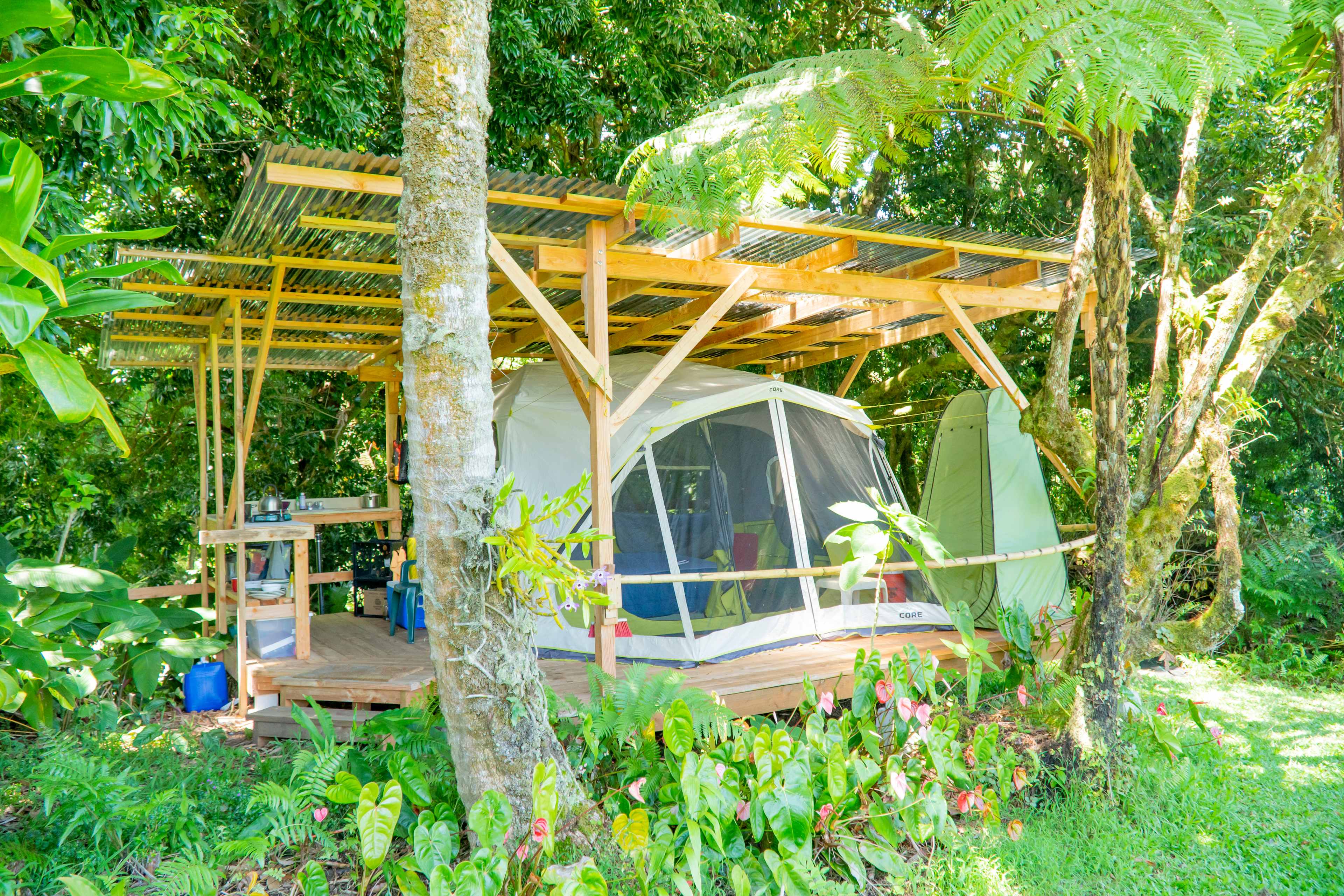 Here's the tent, outdoor kitchen, and the green potty tent.