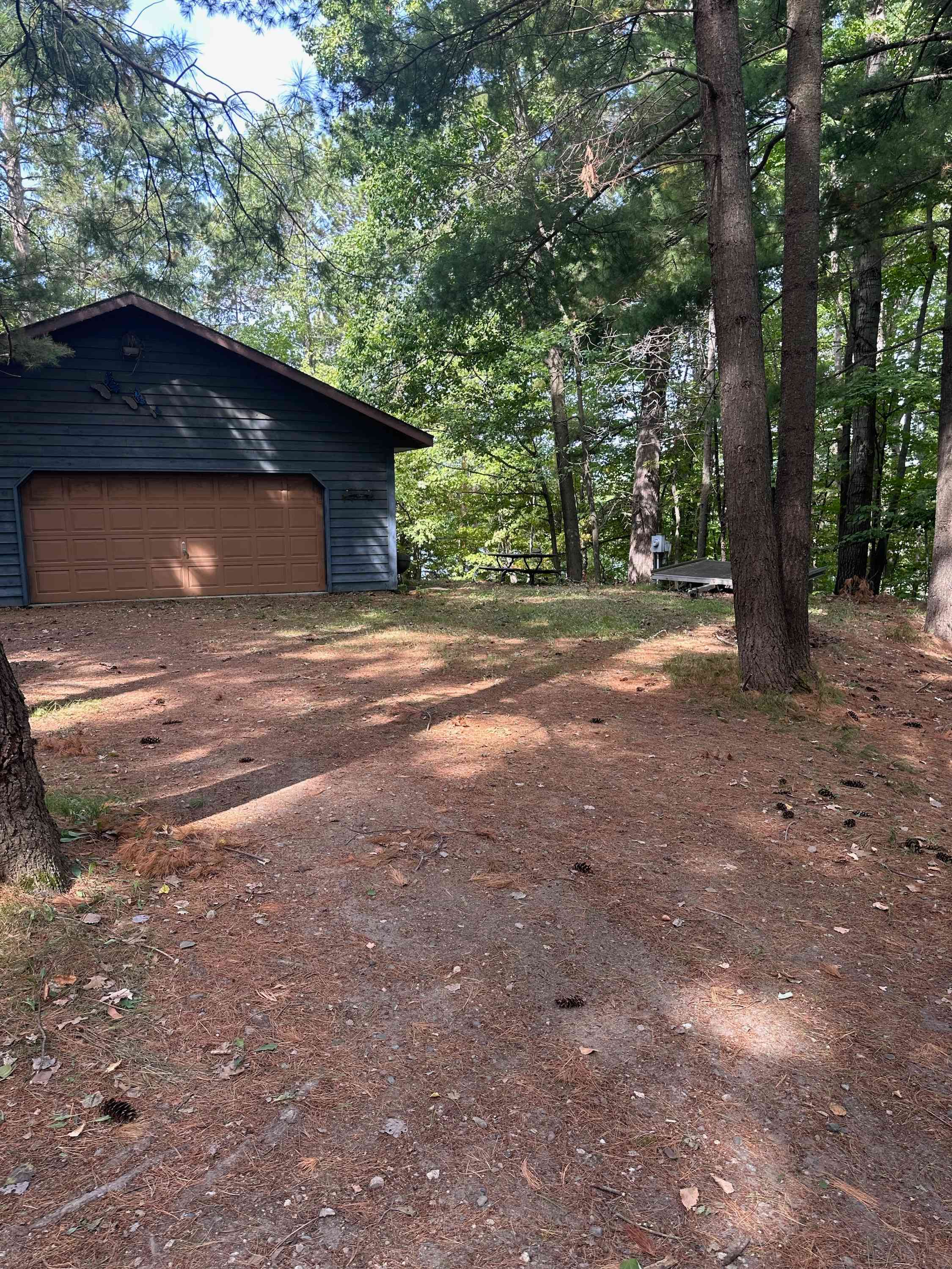 View of property. No garage access. You may camp or park anywhere near the garage. All RVs and cars must be parked in driveway.