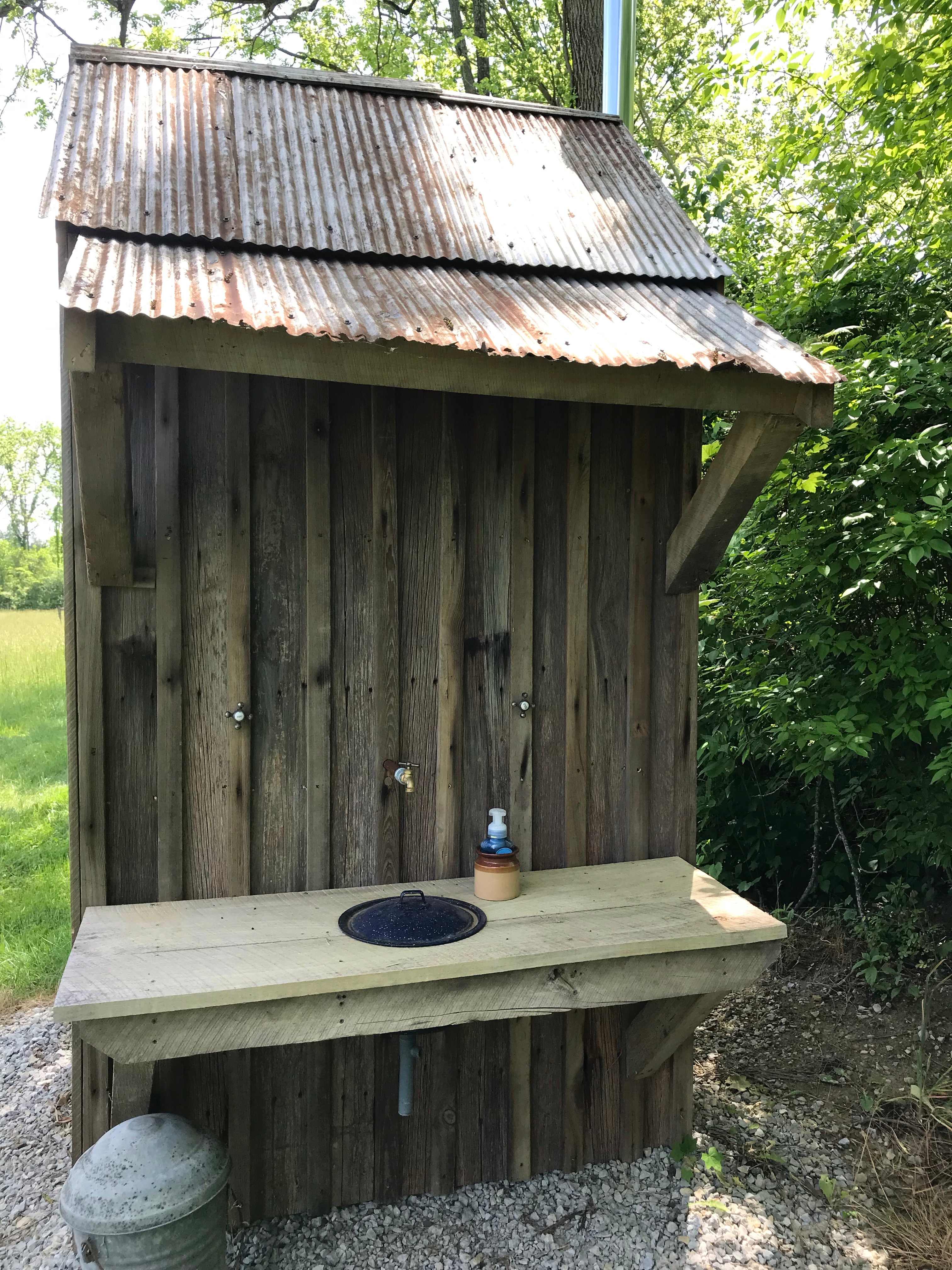 Outhouse sink. Soap and toilet paper provided.