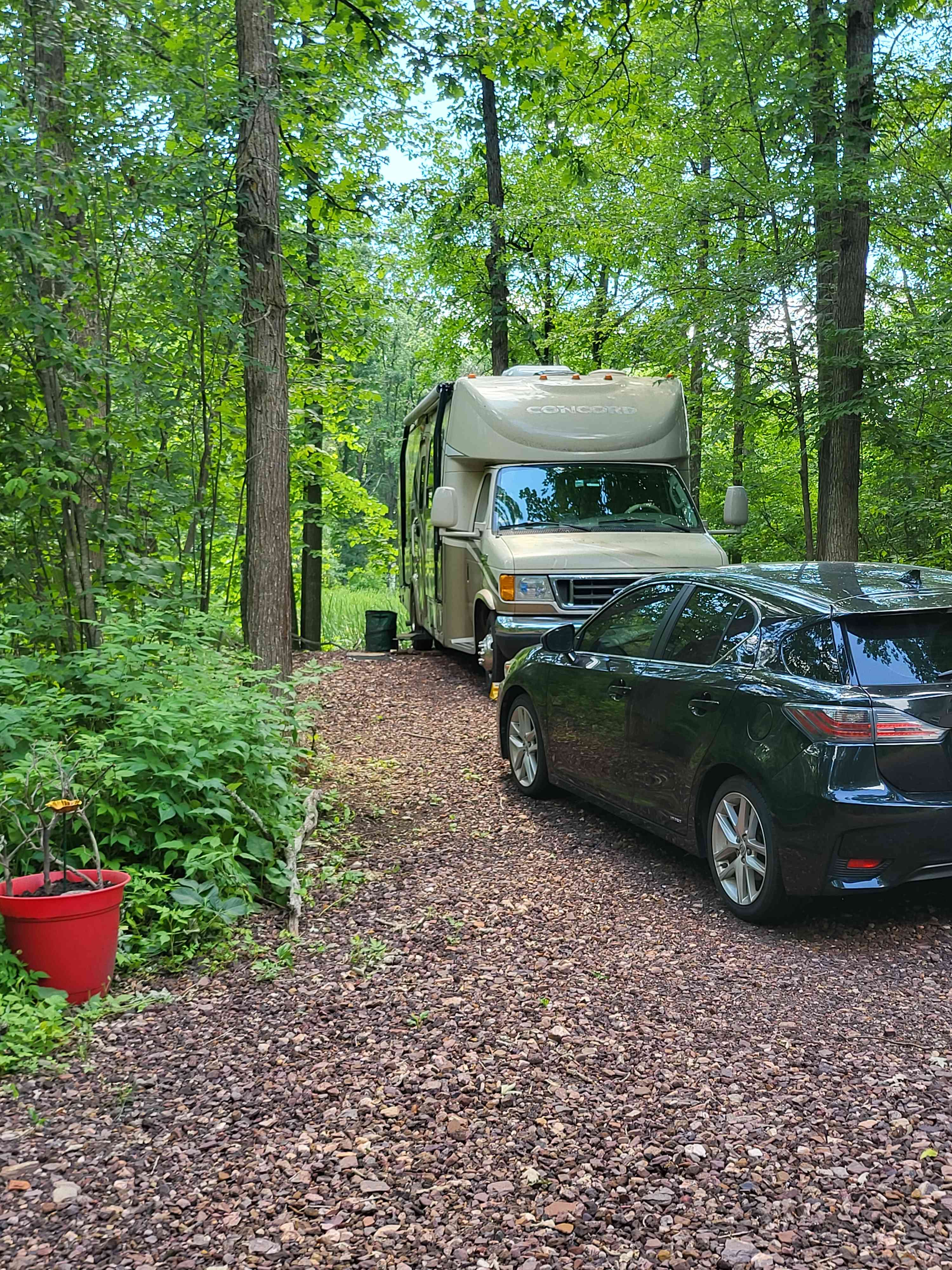 Example of an RV and Car to demonstrate the size of the site. RV here is 30 feet. 