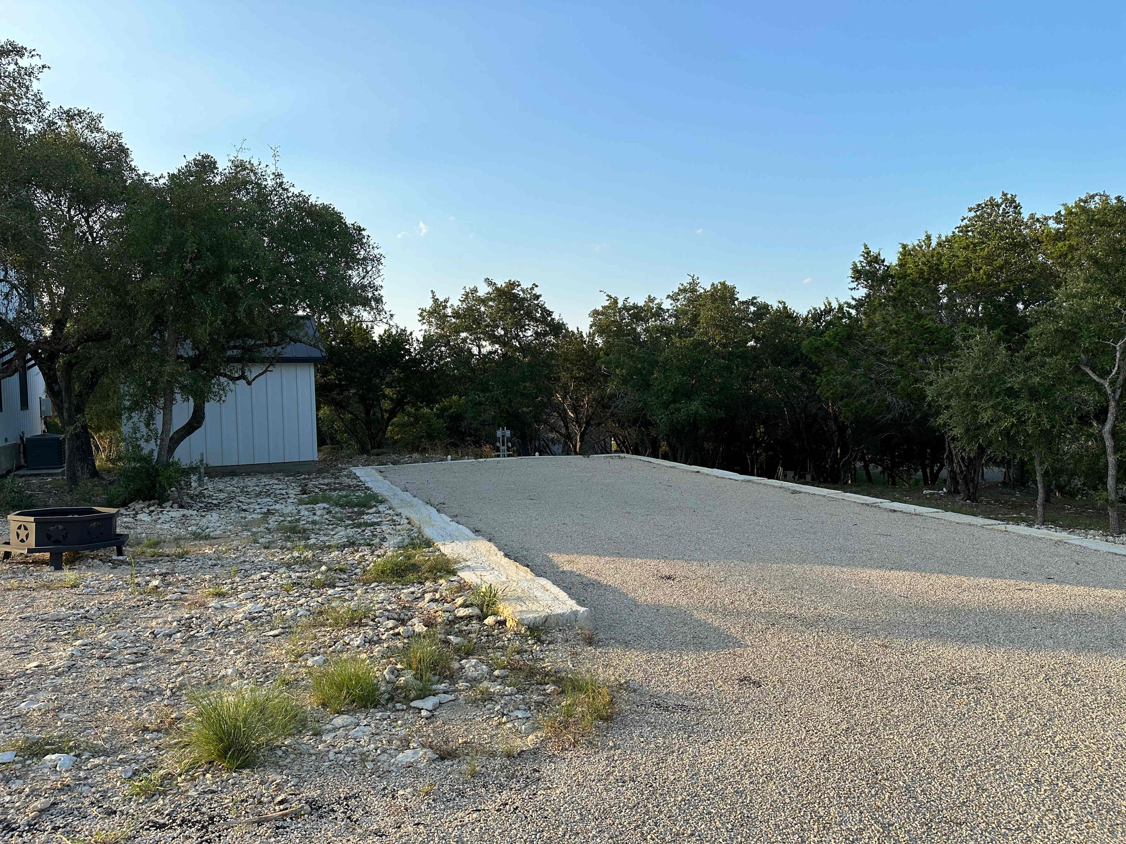Site pad accommodates two RVs and is situated next to the fire pit for evening chats