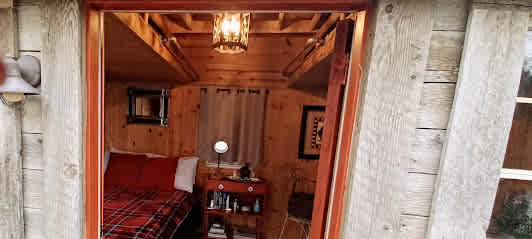 ANOTHER VIEW OF THE HUGGERY'S BEDROOM. The window next to the bed overlook the outdoor kitchen so it's easy to keep your eyes on what's cooking!