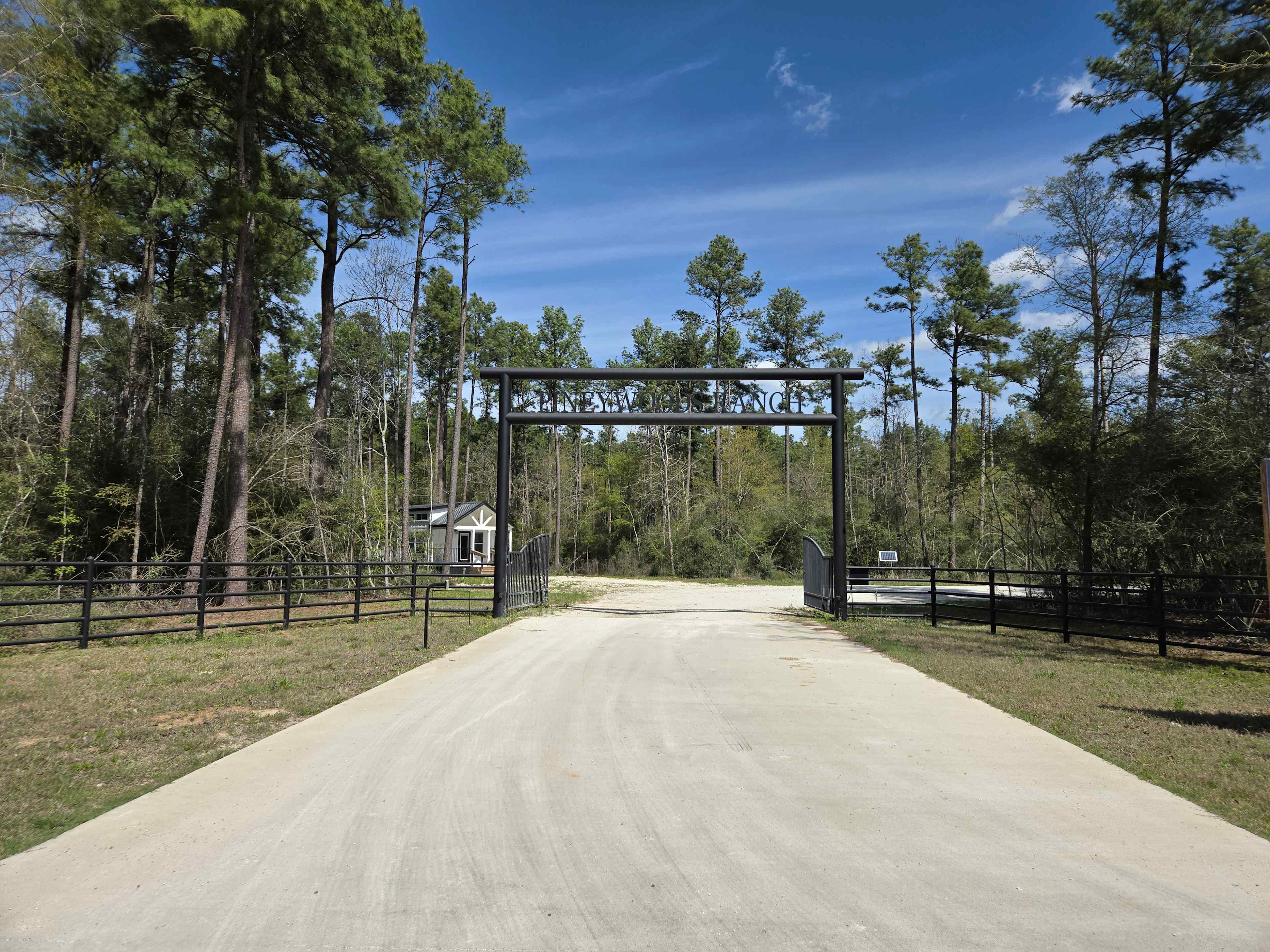 Main entrance into the community. Pineywoods Ranch